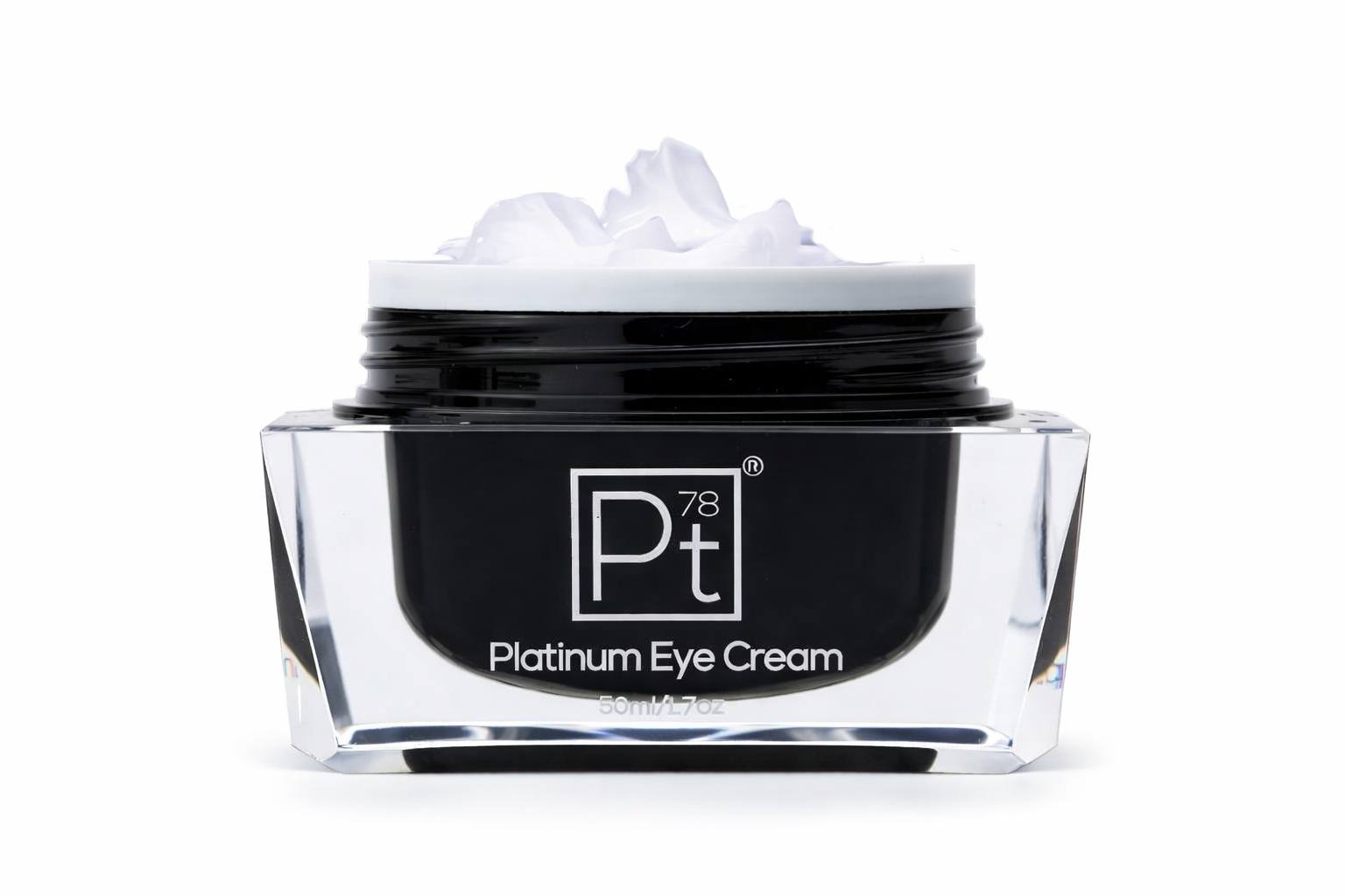 Luxury platinum eye cream in crystal glass jar with open lid, anti-aging eye treatment for dark circles, puffiness, and fine lines