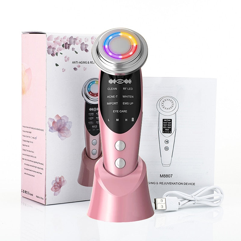 Pink 7-in-1 RF & LED facial lifting massager with charging base, USB cable and box