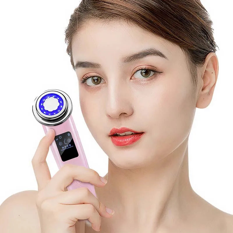 Model using LED facial wand on cheek