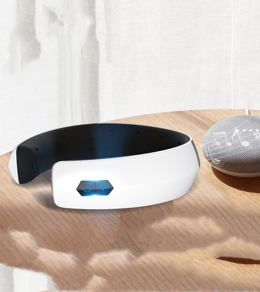 Close-up of white Fav Naomi Eye Therapy Mask on a cushion, USB-rechargeable.