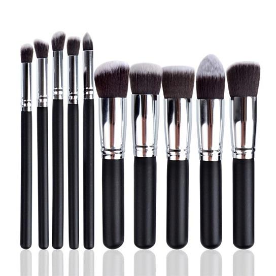 10-piece black makeup brush set arranged diagonally on a white background.
