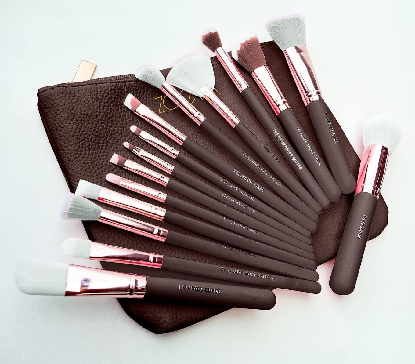 15-piece rose-gold makeup brush set with brown travel pouch arranged fan-style