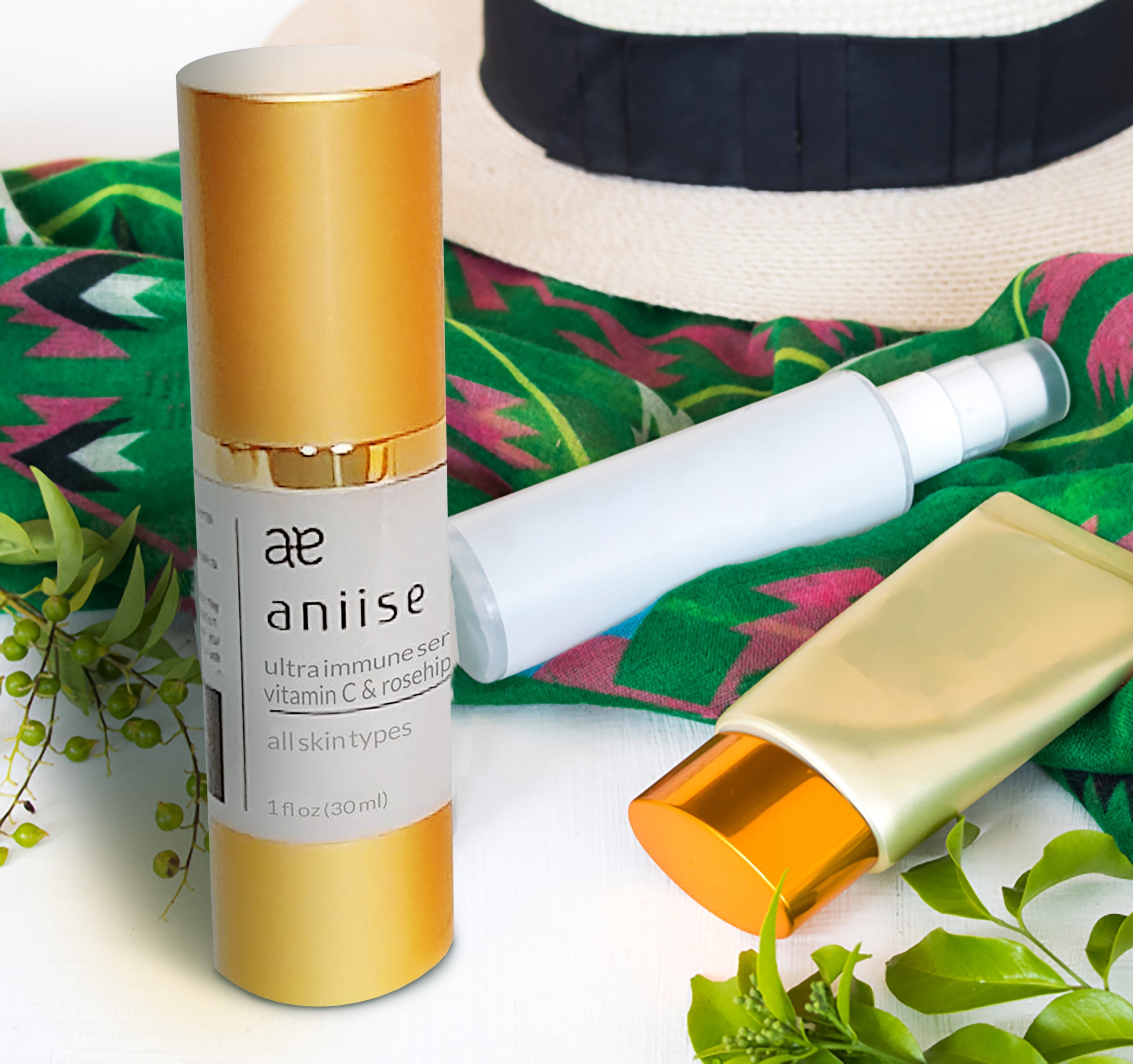 Aniise Vitamin C Serum with citrus and green leaves highlighting antioxidant ing